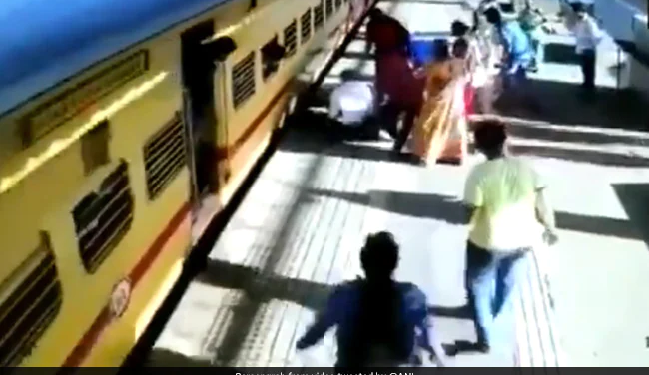 Passengers Saved A Woman From Falling Under A Moving Train At Vasai Road Railway Station