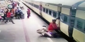 Woman Stuck In The Middle Of Moving Train Railway Cop Drags Out Woman Saved Her Life Caught On Camera