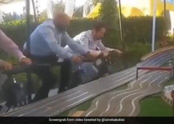 A Car Race That People Are Winning By Pedaling A Cycle The One Who Won The Race Will Get The Reward Of Fitness