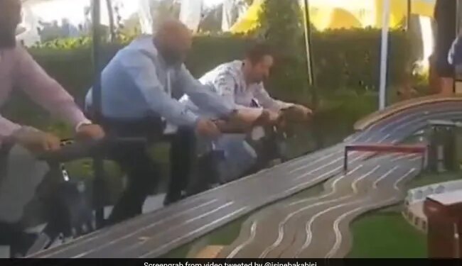 A Car Race That People Are Winning By Pedaling A Cycle The One Who Won The Race Will Get The Reward Of Fitness