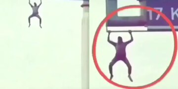 Man Was Seen Doing Pull Ups By Climbing On The Hoarding On Highway Video Viral On Social Media