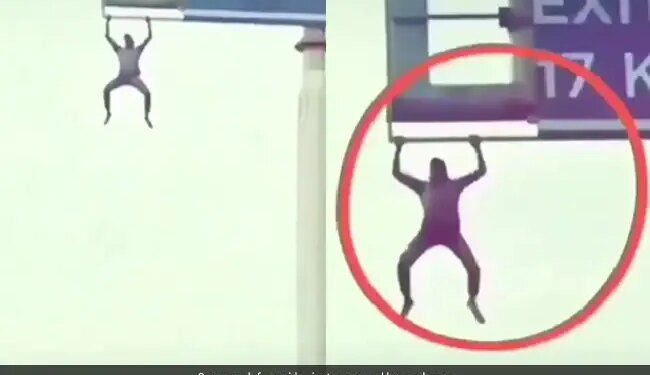 Man Was Seen Doing Pull Ups By Climbing On The Hoarding On Highway Video Viral On Social Media