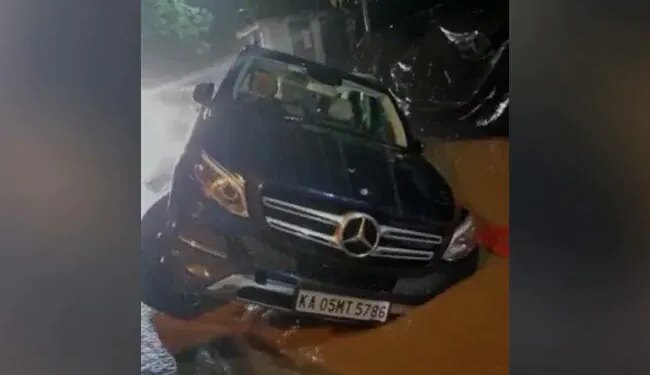 Watch Video: Mercedes SUV Stranded With Two Wheels Up In The Air On Flooded Bengaluru Road