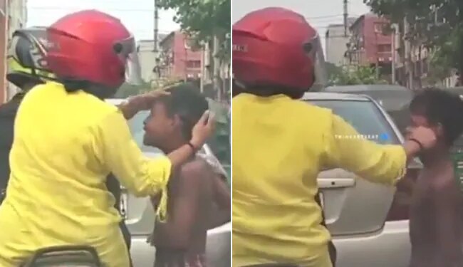 Viral Video Of A Woman Was Seen Helping A Child At A Traffic Signal