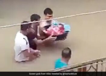 Man Walks Through Deep Water To Bring Newborn Baby Home Amid Assam Floods Watch Viral Video