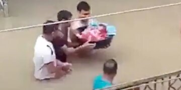 Man Walks Through Deep Water To Bring Newborn Baby Home Amid Assam Floods Watch Viral Video