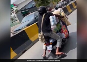 Man Rides Overloaded Scooter Telangana State Police Reacts On Viral Video