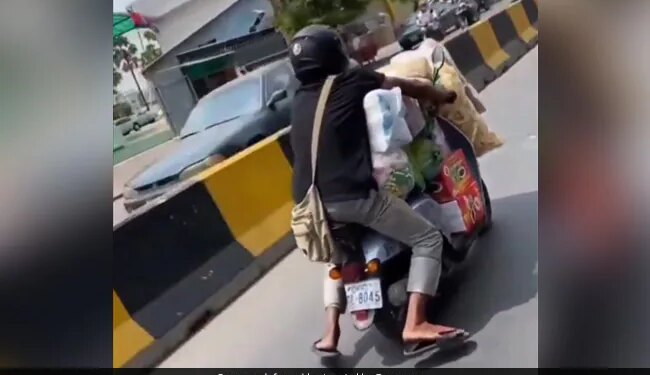 Man Rides Overloaded Scooter Telangana State Police Reacts On Viral Video