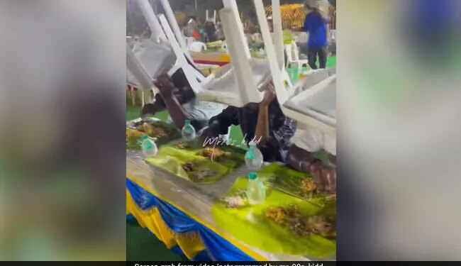 People Were Eating Food In The Wedding Suddenly Start Raining Yet The Guests Were Busy In Eating See Viral Video