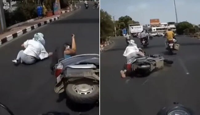 Watch Viral Video: Woman Fell From Scooty Puts Blame On Biker Accident Video Goes Viral On Internet