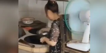 Woman Did Amazing Jugaad In Kitchen Tied A Chair Around Her Waist And Put A Table Fan On It Watch Viral Video – किचन में गर्मी से बचने के लिए महिला ने किया गजब जुगाड़, कमर में बांधी कुर्सी और लगा लिया टेबल फैन