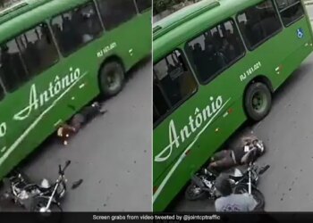 Biker Fell Under The Moving Bus Wheel Had Climbed On His Head But The Helmet Saved His Life Watch Hair Raising Video