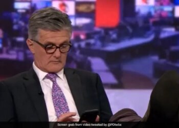 BBC Anchor Scrolling On Phone With Feet Up On Desk Mid Live Broadcast Caught On Camera