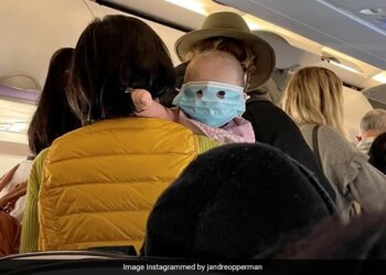 Baby Wearing A Full Face Mask On On New Zealand Flight In Viral Photo Internet Says Example Of Child Abuse