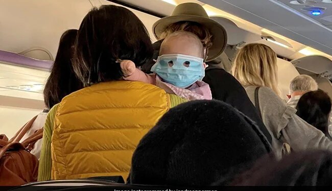 Baby Wearing A Full Face Mask On On New Zealand Flight In Viral Photo Internet Says Example Of Child Abuse