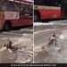 Man Lying Comfortably On A Waterlogged Street Amid Mumbai Rains Internet Says Feeling Maldives In Malad See Viral Video – मुंबई की बारिश में पानी से भरी सड़क पर आराम से लेटकर चिल करते दिखा शख्स, लोग बोले