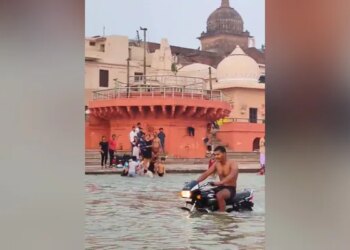 Viral Video: Man Drives Bike Inside Holy River Saryu In Ayodhya, People Get Angry