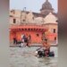 Viral Video: Man Drives Bike Inside Holy River Saryu In Ayodhya, People Get Angry