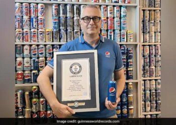 Italian Man Sets Guinness World Record By Holding More Than 1200 Pepsi Cans