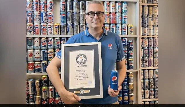 Italian Man Sets Guinness World Record By Holding More Than 1200 Pepsi Cans
