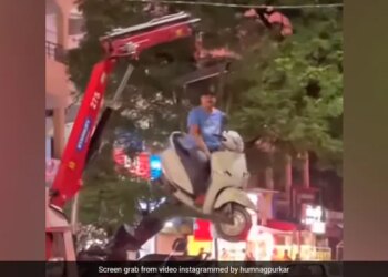 Man Sits On Scooter As It Hangs In Air While Getting Towed In Nagpur See Bizarre Viral Video
