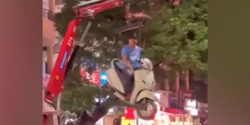 Man Sits On Scooter As It Hangs In Air While Getting Towed In Nagpur See Bizarre Viral Video