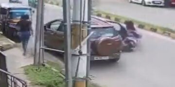 Woman Rider Run Over After Being Hit By Door Of Parked Car Suddenly High Speed Car Passed Over Her Caught On Camera