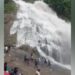 A Sudden Flash Flood Surprised Visitors At A Waterfall | Due To Heavy Rain Flood Came On The Waterfall Video