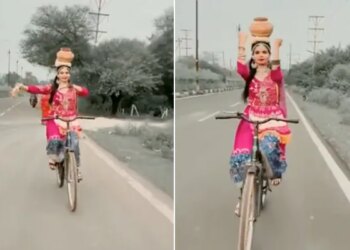 VIDEO: Classical Dance On A Cycle With An Urn On Her Head The Girl Won Her Heart