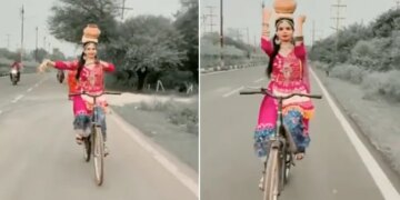 VIDEO: Classical Dance On A Cycle With An Urn On Her Head The Girl Won Her Heart