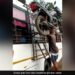 Man Put The Motorcycle On His Head Climbs On Bus Roof Without Holding It Internet Call Him Real Bahubali See Viral Video – शख्स ने सिर पर रखी मोटरसाइकिल, बिना हाथों से पकड़े बस पर लेकर चढ़ गया, लोग बोले