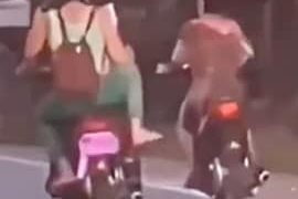 Girl Falls While Trying To Kick A Bike Rider Video Viral, Woman Falls While Trying To Kick Bike Rider