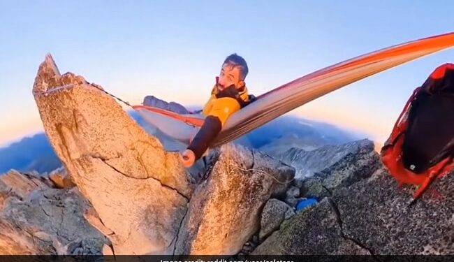 Man Sleeps In A Hammock Between Two Mountains Internet Stunned To See This Hair Raising Video