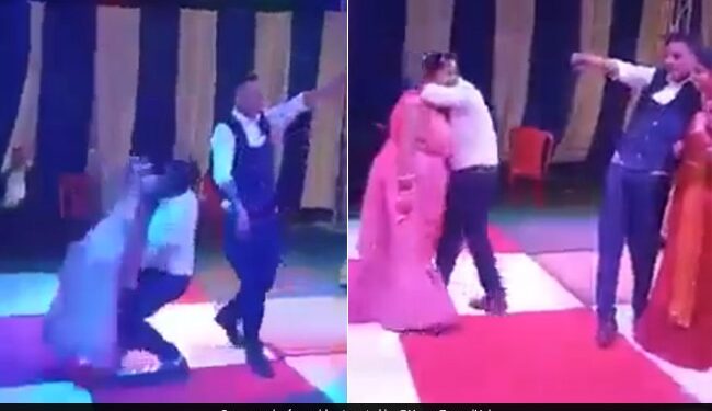 Man Lifting The Woman In His Lap On Dance Floor Fell Down Badly Internet Loves This Funny Viral Video – डांस फ्लोर पर शख्स को चढ़ा रोमांस, महिला को गोद में लगा उठाने, फिर जो हुआ, लोग बोले