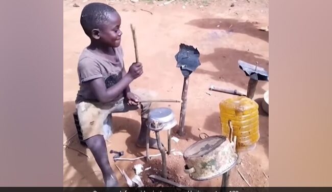 Desi Jugaad: Little Boy Plays Drums Made Out Of Empty Vessels And Wooden Sticks