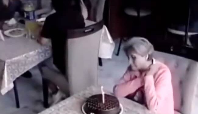A Woman Was Celebrating Her Birthday By Cutting A Cake Alone, Then Something Happened That Will Make You Emotional