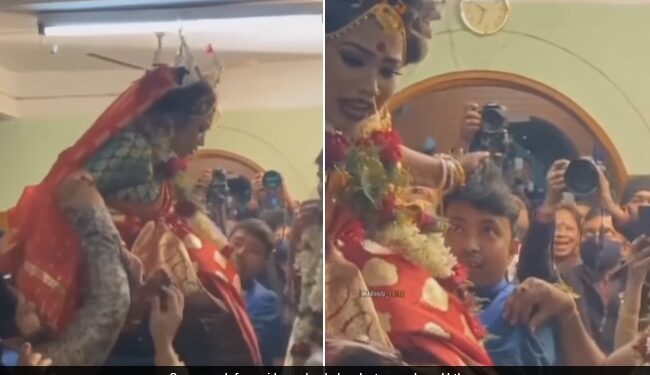Boys Lifted The Bride In Her Lap Then Bride Hold Boy Hair Tightly In Such A Way And Pulled It Out See Funny Wedding Video