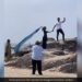Elderly Couple Helps Daughter In Law To Click A Perfect Picture With Husband On The Beach Viral Video Wins Hearts
